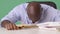 Stressed African American Businessman banging head on desk