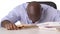 Stressed African American Businessman banging head on desk