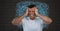 Stressed anxious and frustrated man with intense doodles on wall