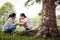 Stressed asian child girl sitting crying and thinking about problems at park,sad female teenage having psychological trouble with