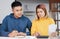 Stressed Asian couple serious calculate home financial bill budget on table in kitchen at new house