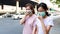 Stressed asian mother and daughter with hygienic mask walking outdoor,allergy to dust,pollution,dirty air,PM 2.5,health care,virus