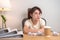 Stressed Asian woman having Tired and Sleepy while working, female businesswoman having headache at office, Exhausted woman with