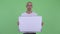 Stressed bald man holding white board and getting bad news