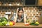 Stressed beautiful young woman in kitchen. Tired at home.