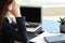 Stressed businesswoman with non-working laptop sitting at workplace in office