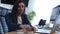 Stressed businesswoman working at her desk in work