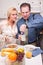 Stressed Couple in Kitchen Late for Work