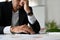 Stressed and failure asian businessman at his office desk. cropped image