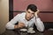 Stressed Man Having a Cup of Coffee at the Table