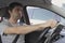 Stressed man holding steering wheel with desperate look