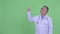 Stressed mature Japanese man doctor pointing up