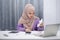 Stressed muslim woman calculating monthly financial, plan budget on computer, pay bills or taxes online at home.