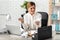 Stressed woman crumpling paper at workplace