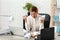 Stressed woman crumpling paper at workplace