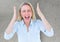 Stressed woman in front of cracking stone