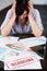 Stressed woman in office thinking about deadline.