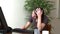 Stressed woman working at a computer