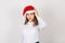 Stressed worried unhappy young woman in Christmas hat, looking down, having headache migraine isolated white background. Having