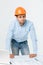 Stressed young constructor having headache or migraine looking exhausted and worried on white background with