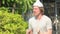 Stressed young man with tinfoil hat as conspiracy theory concept panicking outdoors