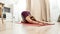 Stretch, relax and replenish. Full-length shot of young curvy woman in sportswear sitting in the Child pose on a yoga