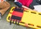 Stretcher yellow and patient injured for emergency paramedic service Injury with medical equipment in emergency rescue situation