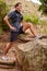 Stretching, fitness and man in forest for running, training or outdoor exercise goals, challenge and sports in nature