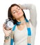 Stretching girl with alarm clock