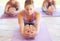 Stretching for wellbeing. Young yoga instructor leading a class.