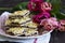 Streusel pie with currant and rose petal filling on a background of tulips.