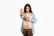 Strict young pregnant lady gesturing stop looking severely at camera forbidding or warning, white background