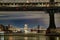 Striking aerial view of the Brooklyn bridge illuminated against a dark night sky