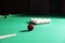 Striking ball on billiard table