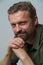 Striking close-up portrait of confident European man captured in professional photo studio. With meticulous attention to