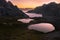 Striking panorama of the lake and mountain refuge in the Three peaks of Lavaredo park seen at dawn