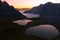 Striking panorama of the lake and mountain refuge in the Three peaks of Lavaredo park seen at dawn