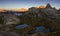 Striking panorama of the lake and mountain refuge in the Three peaks of Lavaredo park seen at dawn