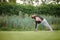 Striking a pose at the park. a handsome mature man doing yoga at a park.