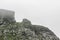 Striking rock formation cliffs fog clouds, VeslehÃ¸dn Veslehorn mountain, Hemsedal