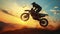 The Striking Silhouette of a Motocross Rider, Front Wheel Raised, Embodying Daring