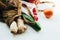 String bag with various fresh vegetables on white background