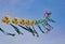 A string of colorful chinese kites before blue sky