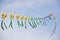 A string of colorful chinese kites before blue sky