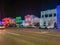 String of lights at the Big, Bright Light Show on main street Rochester Road in Downtown Rochester, Michigan with stores and