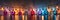 A string of multicolored lights hanging from a wire. Panoramic image