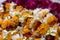 Strings of fresh, bright, floral garlands for celebration and religious offerings at a local flower market in Varanasi, India