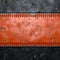 Strip of metal with rivets painted red in the shape of a rectangle in the center on black metal background 3d