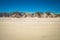 Stripe of white sand dune and plants on the beach in Abel Tasman