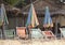 Striped beach chairs and umbrellas on a beach island off Thailand